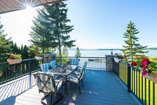 34777 Compass Ln, Polson, MT 59860 - deck featuring a water view and outdoor dining area