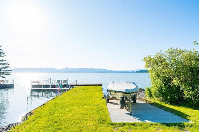 34777 Compass Ln, Polson, MT 59860 - dock area with boat lift and a water and mountain view