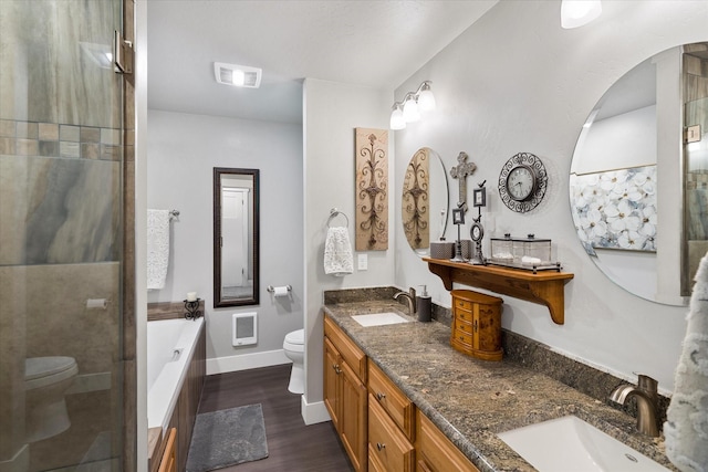 34777 Compass Ln, Polson, MT 59860 - bathroom with toilet, a garden tub, heating unit, and wood finished floors