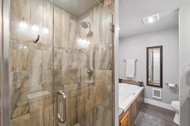 34777 Compass Ln, Polson, MT 59860 - bathroom with toilet, a shower stall, heating unit, baseboards, and a bath