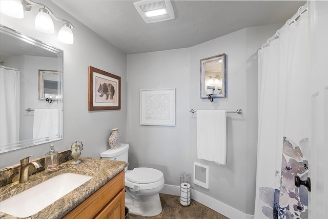 34777 Compass Ln, Polson, MT 59860 - full bath with vanity, toilet, baseboards, heating unit, and a shower with curtain