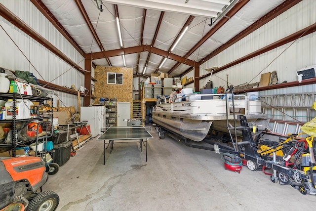 34777 Compass Ln, Polson, MT 59860 - garage featuring metal wall and a workshop area