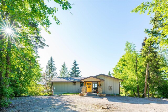 34777 Compass Ln, Polson, MT 59860 - view of front of house featuring board and batten siding and driveway