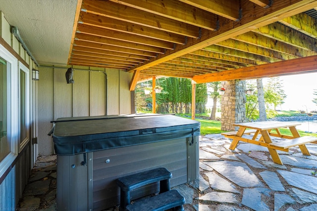 34777 Compass Ln, Polson, MT 59860 - view of patio / terrace featuring a hot tub