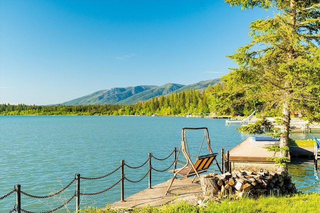 34777 Compass Ln, Polson, MT 59860 - water view featuring a mountainous background and a heavily wooded area