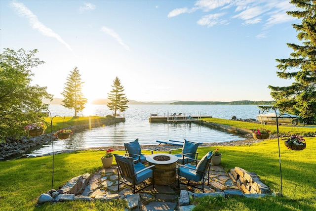 34777 Compass Ln, Polson, MT 59860 - view of patio with a fire pit, a water view, and a boat dock