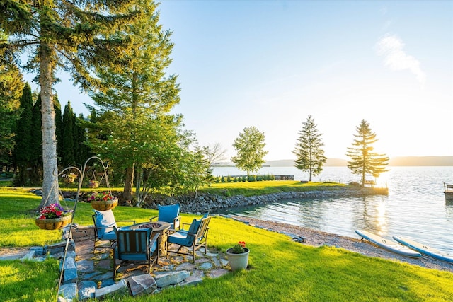 34777 Compass Ln, Polson, MT 59860 - view of grassy yard with a water view and a fire pit