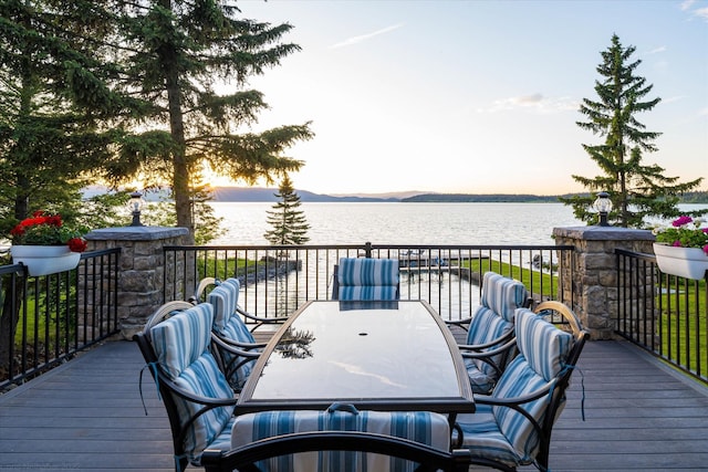 34777 Compass Ln, Polson, MT 59860 - wooden deck with a water view and outdoor dining space