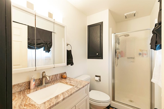 239 Essex St, Lolo, MT 59847 - full bathroom featuring a shower stall, toilet, and vanity