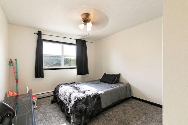 239 Essex St, Lolo, MT 59847 - bedroom featuring a baseboard heating unit, carpet floors, a textured ceiling, and a ceiling fan