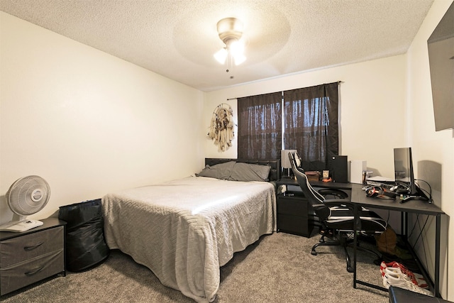 239 Essex St, Lolo, MT 59847 - bedroom with carpet floors, an office area, a textured ceiling, and a ceiling fan