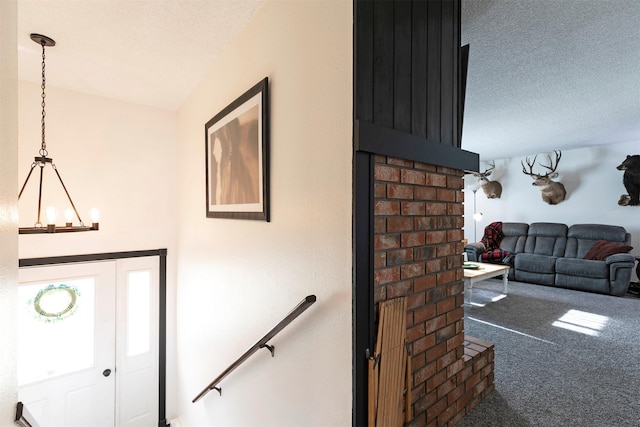 239 Essex St, Lolo, MT 59847 - carpeted entryway featuring a textured ceiling