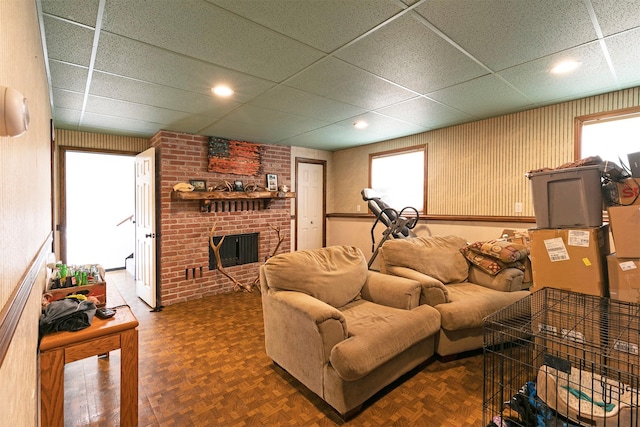 239 Essex St, Lolo, MT 59847 - living area featuring a brick fireplace, a drop ceiling, and recessed lighting