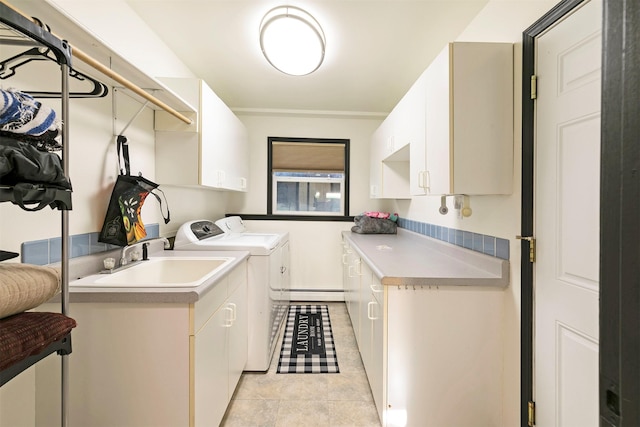 239 Essex St, Lolo, MT 59847 - washroom with cabinet space, washer and clothes dryer, baseboard heating, and light tile patterned floors