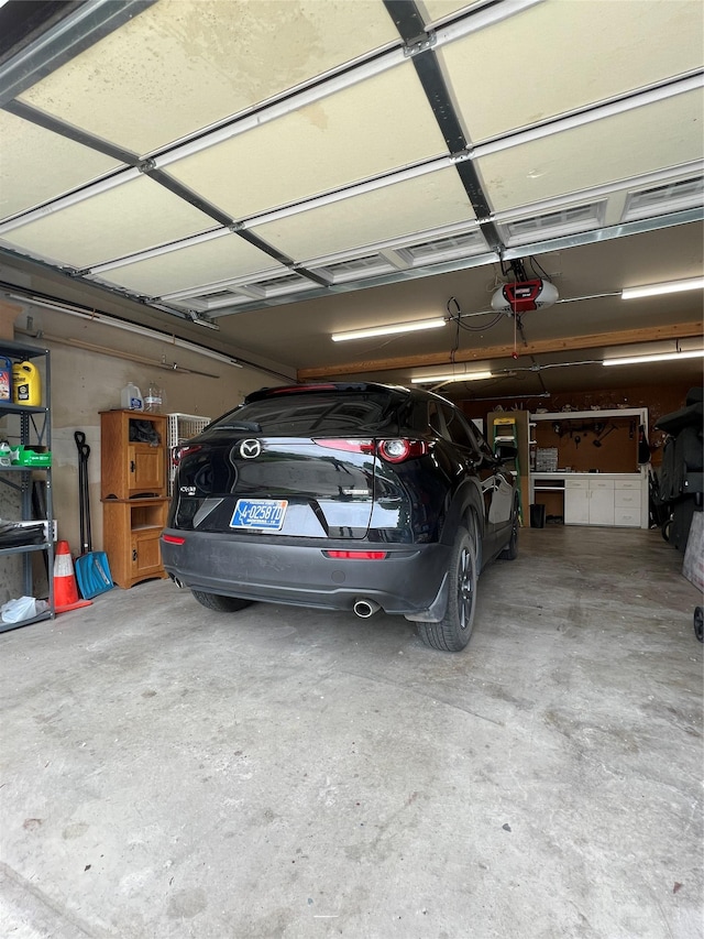 239 Essex St, Lolo, MT 59847 - garage featuring a garage door opener