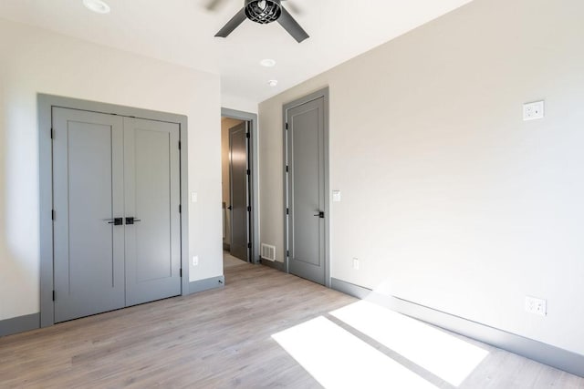 968 Colorado Avenue A And B, Whitefish, MT 59937 - unfurnished bedroom with light wood finished floors, baseboards, ceiling fan, and a closet