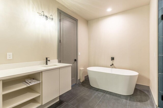 968 Colorado Avenue A And B, Whitefish, MT 59937 - bathroom featuring a freestanding tub, vanity, and recessed lighting