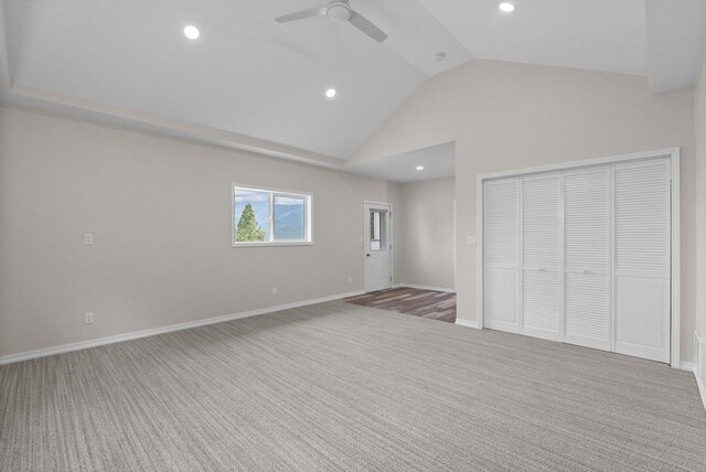 35280 Bennington Ln, Polson, MT 59860 - unfurnished bedroom with carpet, a closet, recessed lighting, high vaulted ceiling, and baseboards
