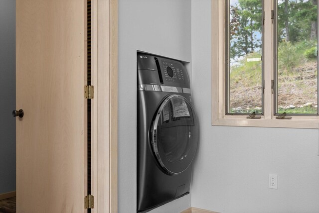 35280 Bennington Ln, Polson, MT 59860 - laundry room with washer / dryer and plenty of natural light