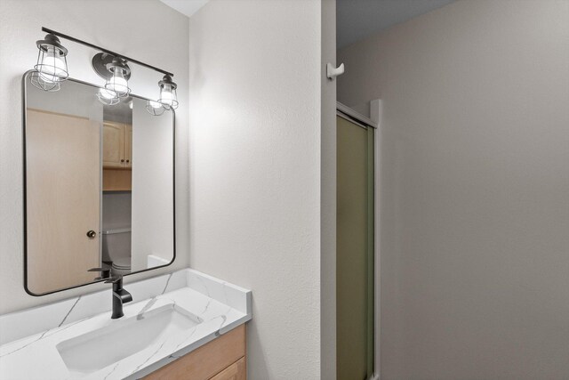 35280 Bennington Ln, Polson, MT 59860 - full bathroom with a stall shower and vanity