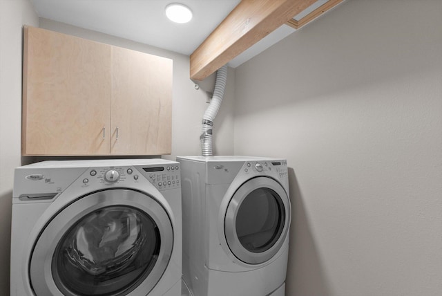 35280 Bennington Ln, Polson, MT 59860 - laundry room with washing machine and clothes dryer and cabinet space