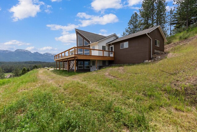 35280 Bennington Ln, Polson, MT 59860 - rear view of property with a deck with mountain view