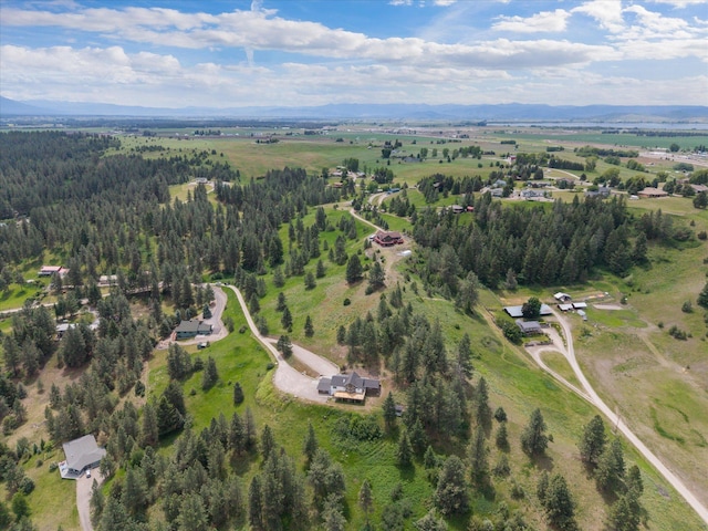 35280 Bennington Ln, Polson, MT 59860 - aerial view of property and surrounding area featuring a heavily wooded area and a mountain backdrop