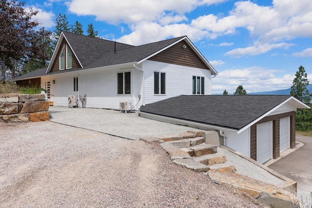 35280 Bennington Ln, Polson, MT 59860 - rear view of property with a shingled roof and a cooling unit