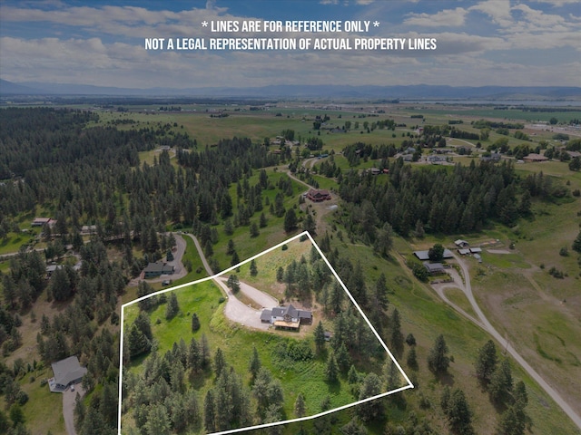35280 Bennington Ln, Polson, MT 59860 - aerial view of property and surrounding area with property parcel outlined and a heavily wooded area