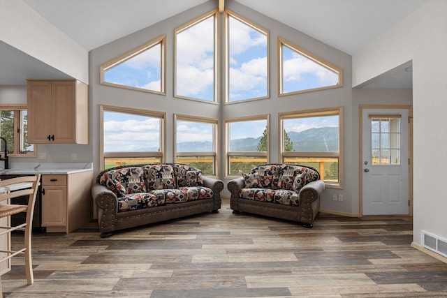 35280 Bennington Ln, Polson, MT 59860 - living room with light wood-style floors, baseboards, and high vaulted ceiling