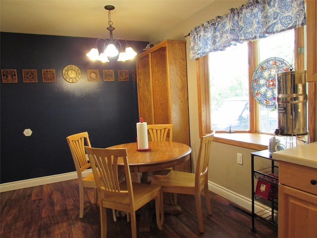 706 49th St S, Great Falls, MT 59405 - dining room featuring a chandelier, dark wood-style flooring, and baseboards