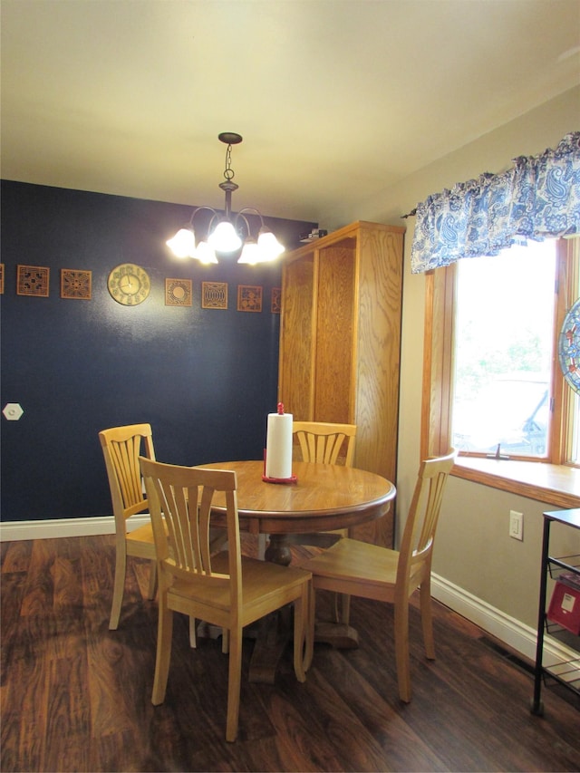 706 49th St S, Great Falls, MT 59405 - dining space featuring a chandelier, wood finished floors, and baseboards