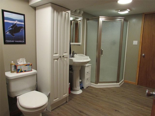 706 49th St S, Great Falls, MT 59405 - bathroom featuring wood finished floors, a stall shower, toilet, and a sink