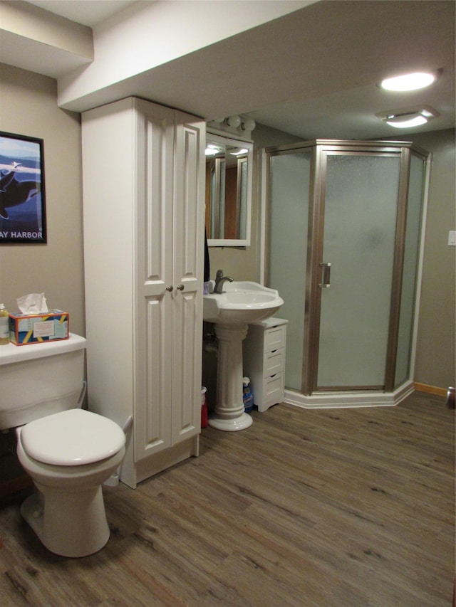 706 49th St S, Great Falls, MT 59405 - full bath featuring wood finished floors, a shower stall, and toilet