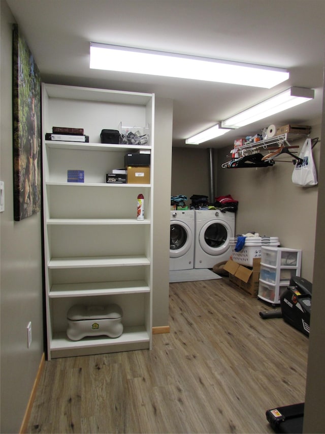 706 49th St S, Great Falls, MT 59405 - washroom with washing machine and dryer, wood finished floors, and baseboards