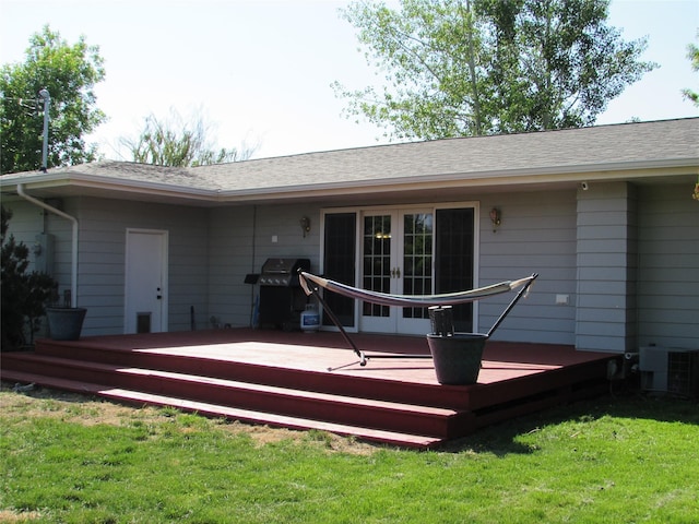 706 49th St S, Great Falls, MT 59405 - rear view of house featuring french doors, a wooden deck, a yard, and central AC