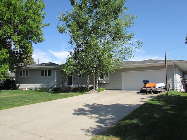 706 49th St S, Great Falls, MT 59405 - single story home with a garage, concrete driveway, and a front lawn