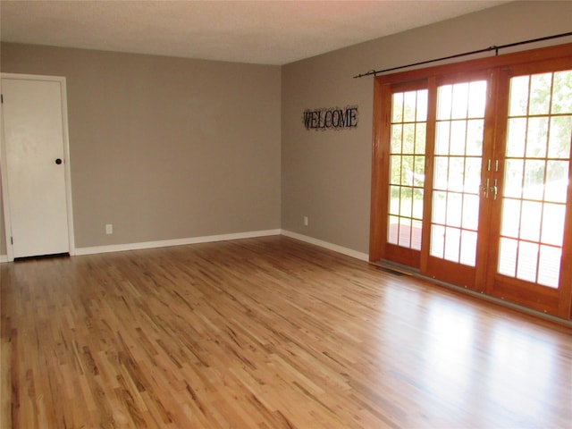 706 49th St S, Great Falls, MT 59405 - spare room featuring plenty of natural light, light wood-style flooring, and baseboards