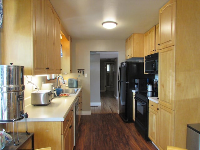 706 49th St S, Great Falls, MT 59405 - kitchen featuring black appliances, a sink, dark wood finished floors, light brown cabinets, and baseboards
