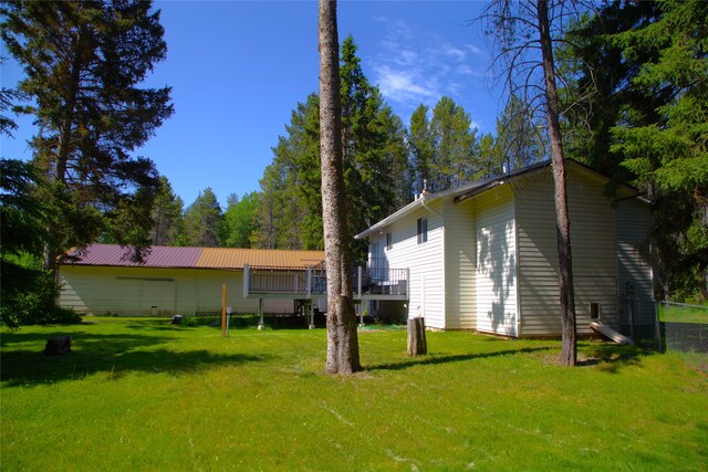 189 Dawn Dr, Columbia Falls, MT 59912 - view of green lawn featuring a wooden deck
