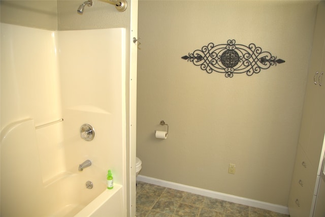 189 Dawn Dr, Columbia Falls, MT 59912 - bathroom featuring toilet,  shower combination, and baseboards