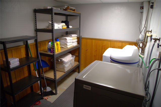 189 Dawn Dr, Columbia Falls, MT 59912 - laundry room with wainscoting, washer / dryer, and wood walls