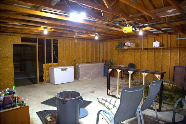 189 Dawn Dr, Columbia Falls, MT 59912 - basement featuring white fridge and a garage