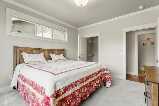 2390 38th St, Missoula, MT 59801 - bedroom featuring crown molding, carpet, baseboards, and a spacious closet