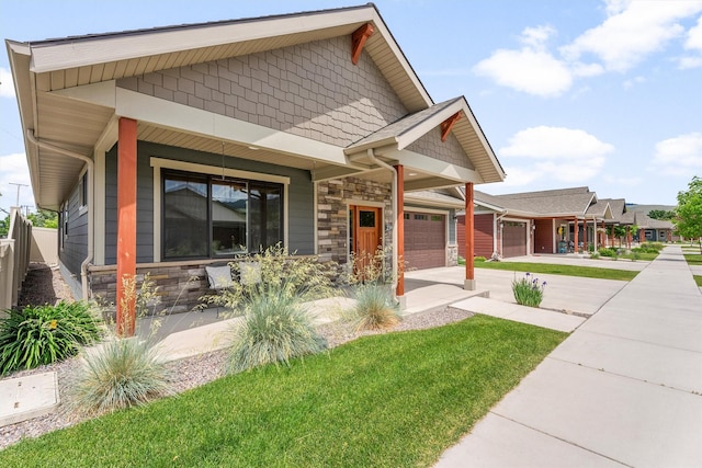 2390 38th St, Missoula, MT 59801 - craftsman inspired home with stone siding, an attached garage, and covered porch