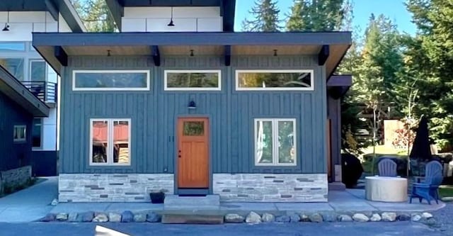 1331 Nelson Ln Cabin H, Unit Cabin H, Whitefish, MT 59937 - rear view of property with board and batten siding and stone siding