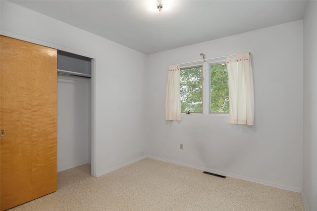 319 W Gail St, East Helena, MT 59635 - unfurnished bedroom featuring a closet, baseboards, and carpet