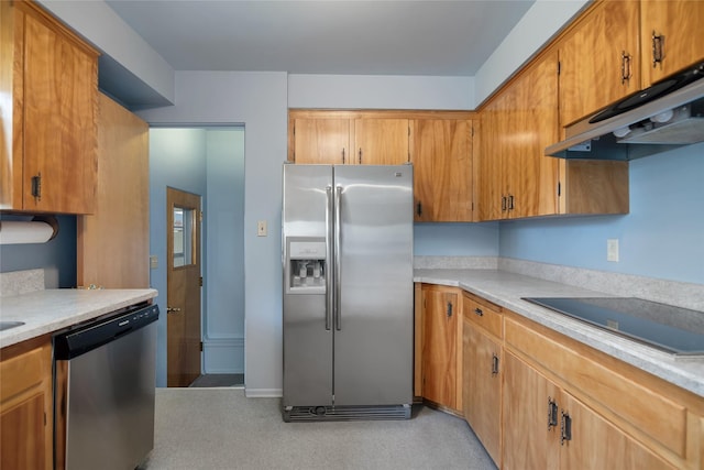 319 W Gail St, East Helena, MT 59635 - kitchen with appliances with stainless steel finishes, under cabinet range hood, light countertops, and brown cabinetry