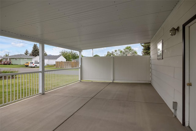 319 W Gail St, East Helena, MT 59635 - view of patio / terrace featuring an attached carport and a residential view