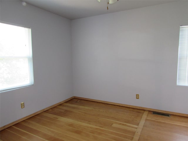 2323 3rd Ave S, Great Falls, MT 59405 - unfurnished room with plenty of natural light, light wood-style flooring, baseboards, and a ceiling fan